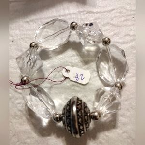 Artemis's Gems custom-made beaded bracelet with large metal engraved bead